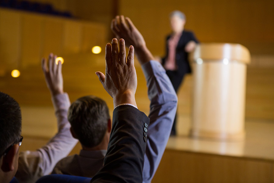 executives raising their hand